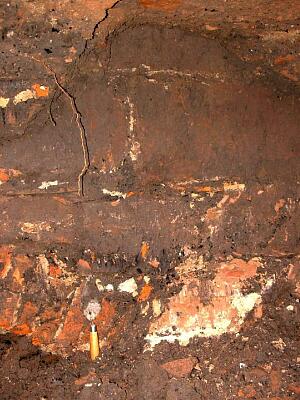 Ashlar face of the medieval city wall and inserted brick arch, excavated behind Bonds Hospital  © Coventry City Council